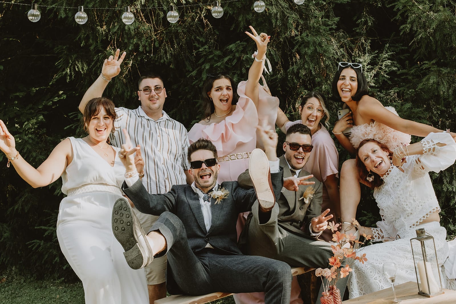 Artistic gay wedding group photo moment – how to make wedding group photos fun with freedom and emotion.