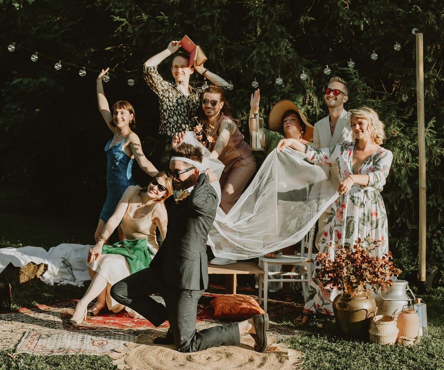 Natural smiles during a wedding photo group – perfect example of how to make wedding group photos fun.