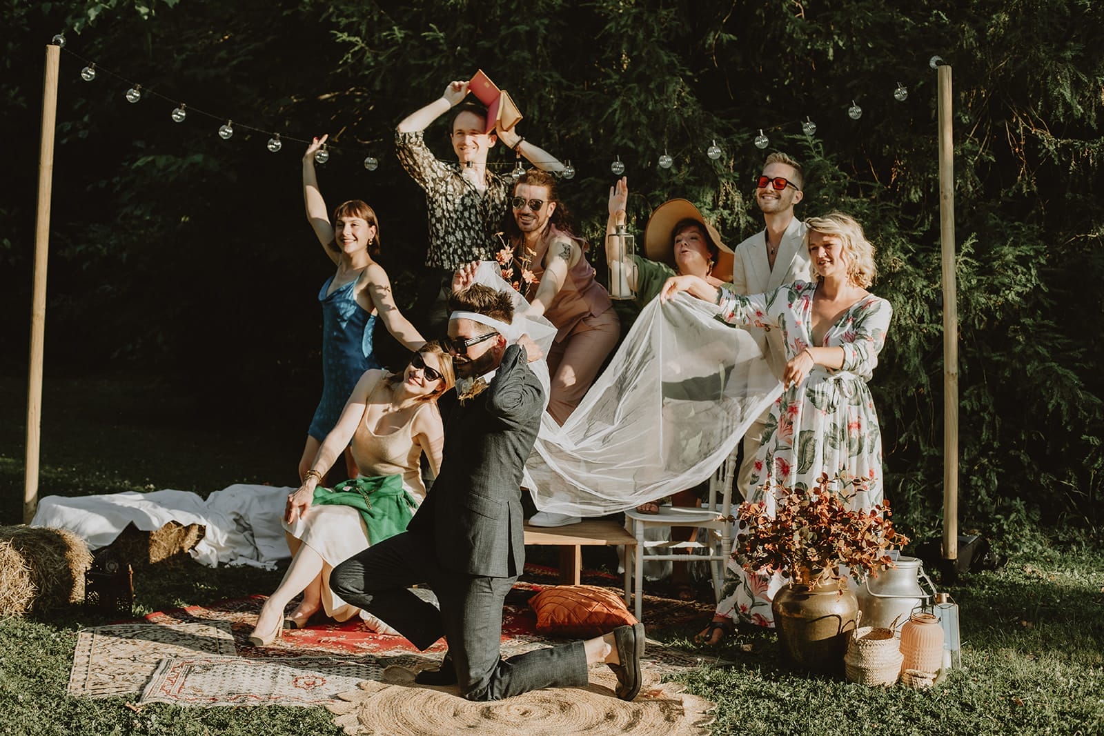 Natural smiles during a wedding photo group – perfect example of how to make wedding group photos fun.