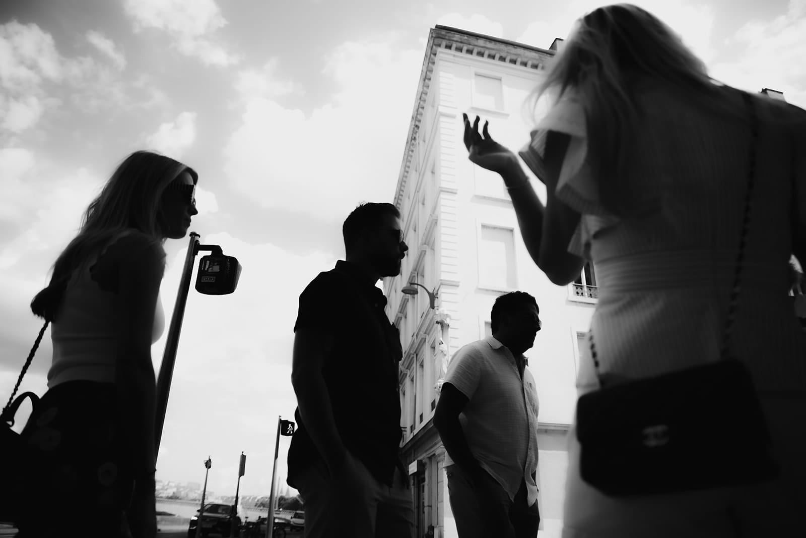 Silhouettes of friends walking through the streets of Lyon