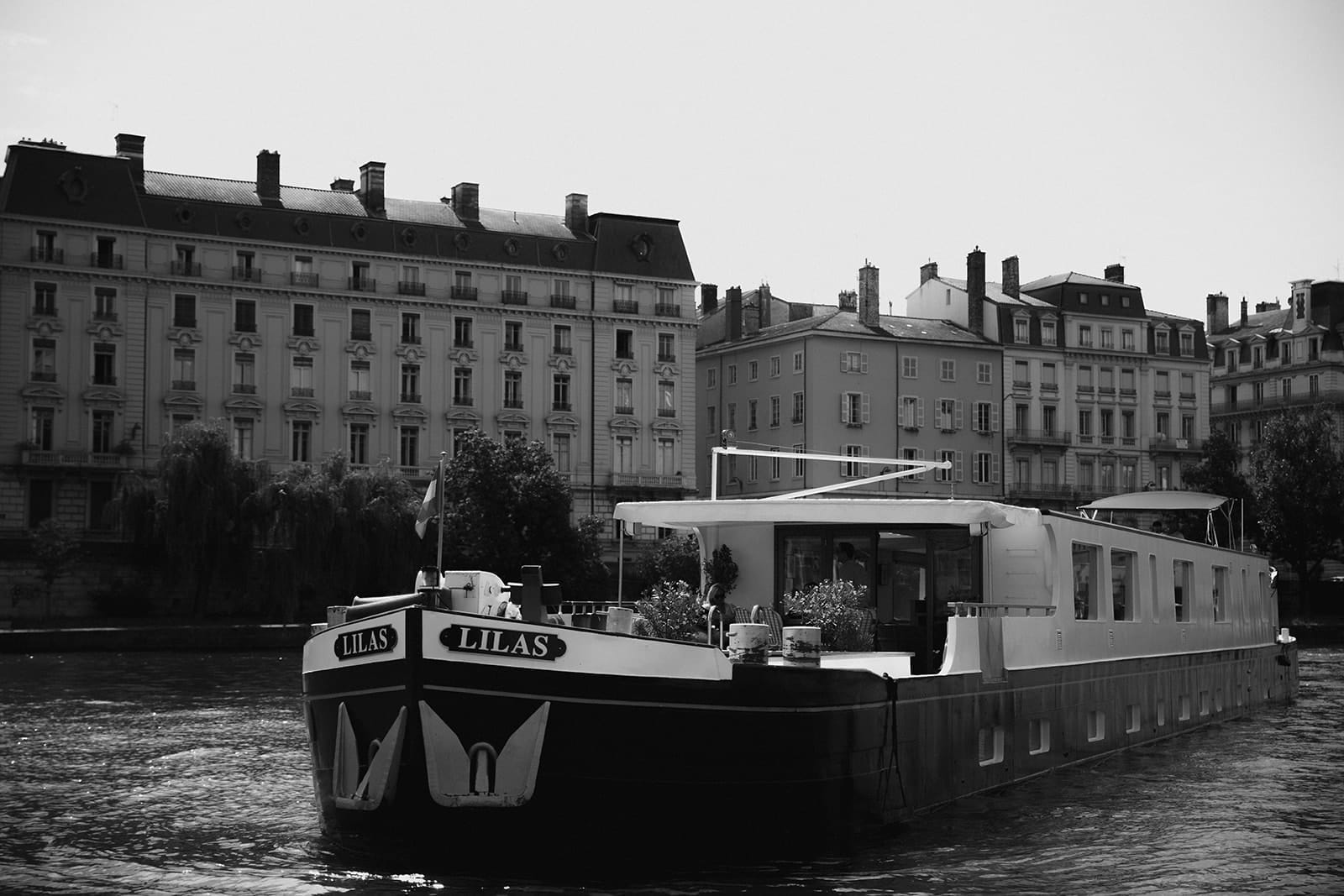 Black and white close-up of the Belmond Lilas boat in Lyon
